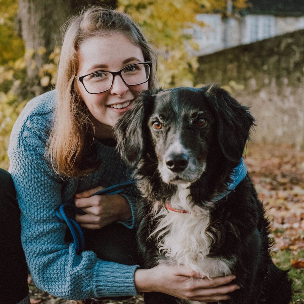 Lucie with a dog in the park